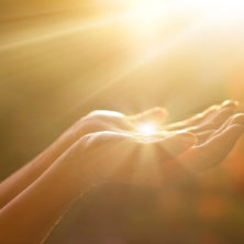 Spiritual hands gaining the light, similar to Karen Kilmartin the Medium channeling from Spirit